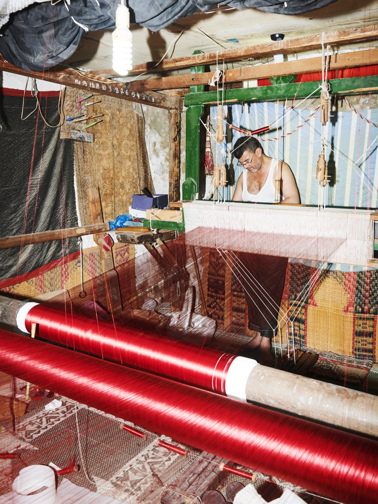 Abedani Chantouri, a sixth-generation silk weaver, works at his traditional loom in his Tunis atelier.