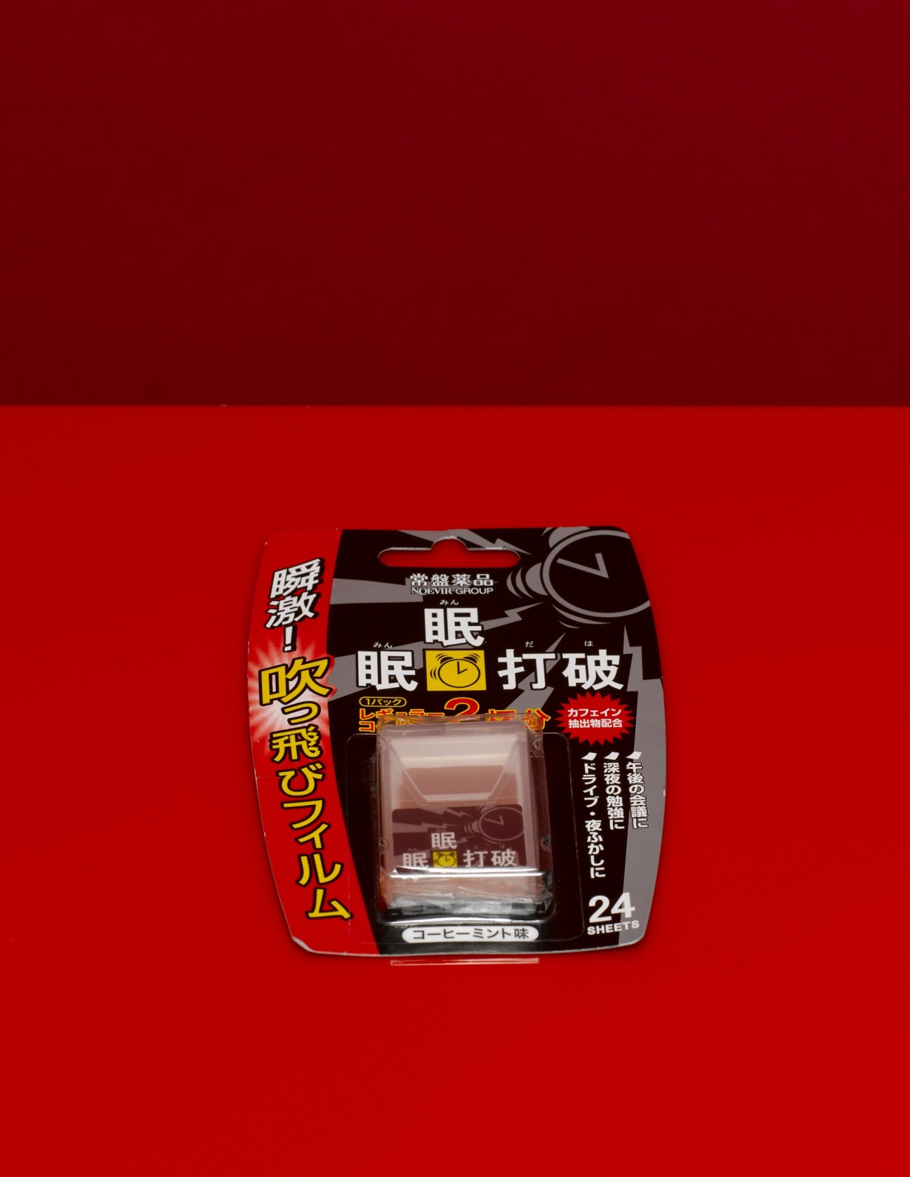 Noevir caffeine strips package with Japanese text and alarm clock illustration on red background.