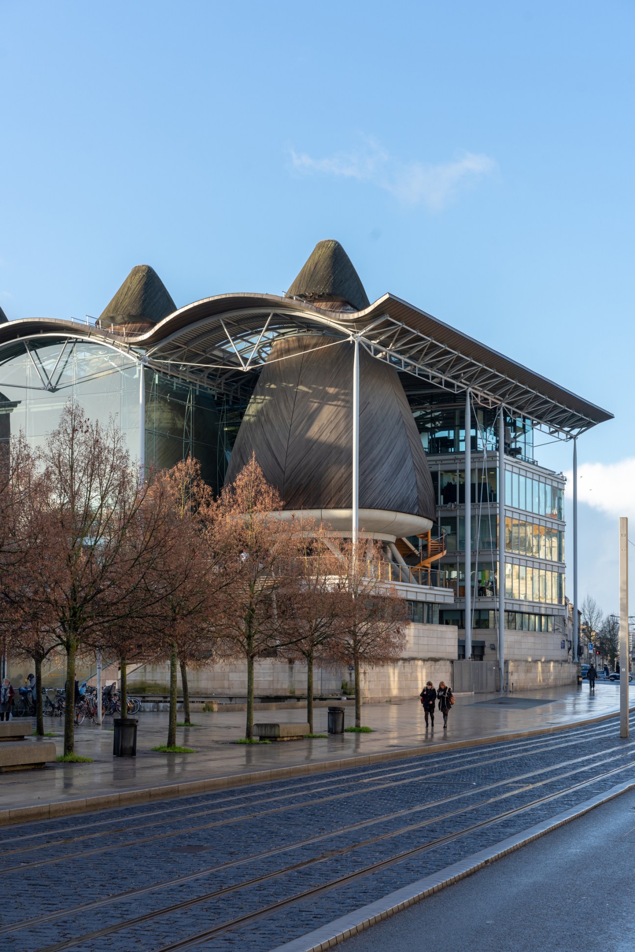 Palais de Justice building in Bordeaux with distinctive cone-shaped roof structures and modern glass facade.