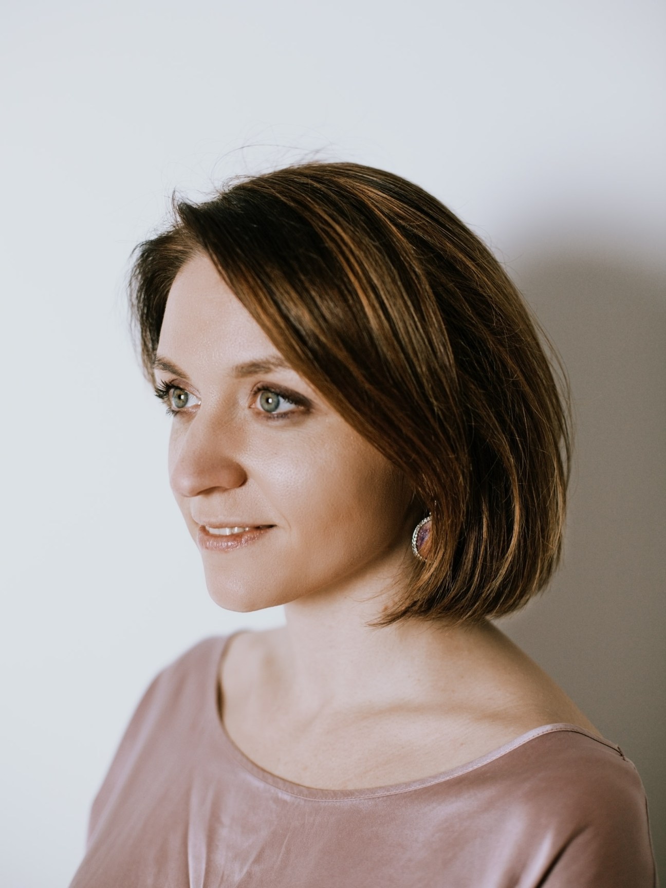 Portrait of Natalia Gryaznevich, Open Russia's press secretary, in profile against a neutral background.