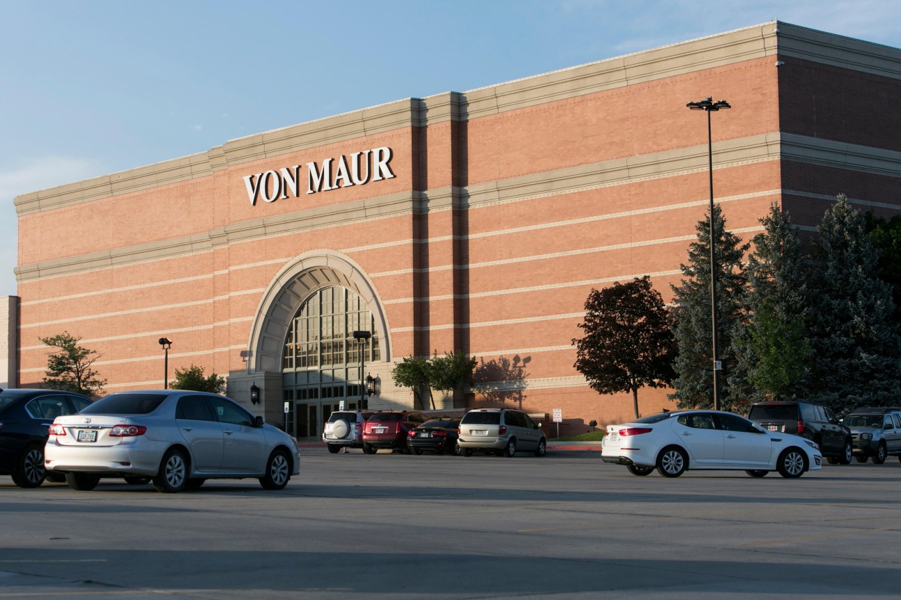 Von Maur department store building exterior in Omaha, Nebraska, with red brick facade and large arched entrance.