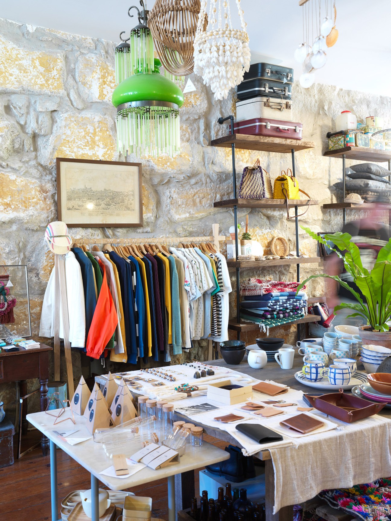 La Paz clothing rack with colorful garments inside Coração Alecrim stockist shop in Porto.