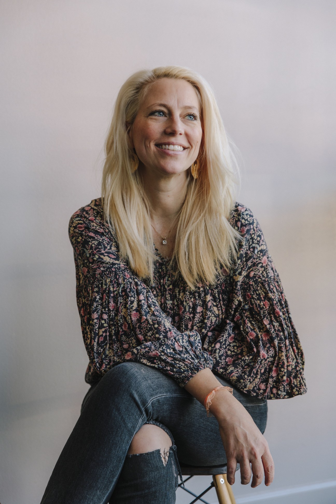 Kathryn Tucker, founder of Arkansas Cinema Society, smiling at the camera in a patterned blouse.