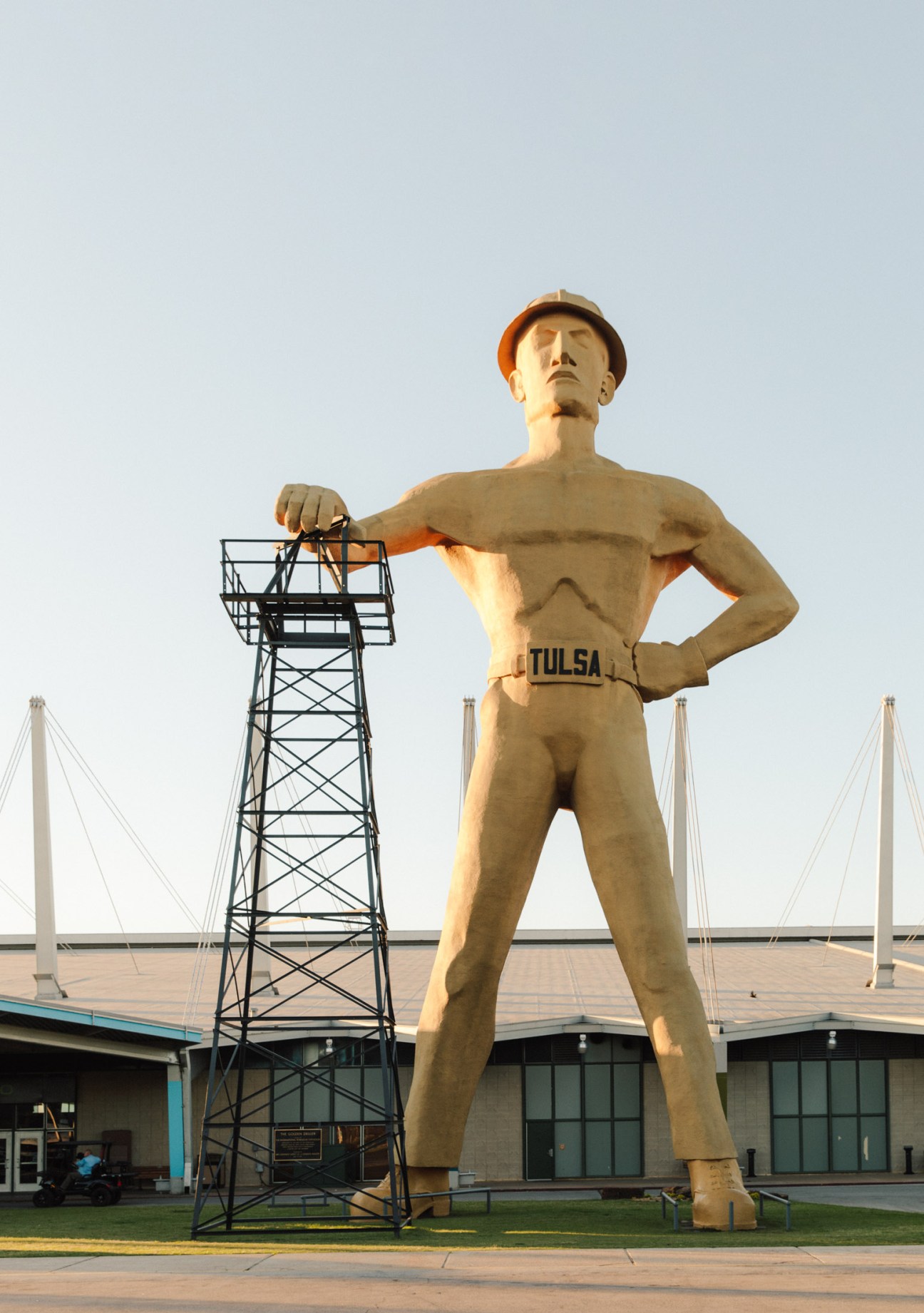 Iconic Golden Driller statue holding an oil derrick in Tulsa, Oklahoma.