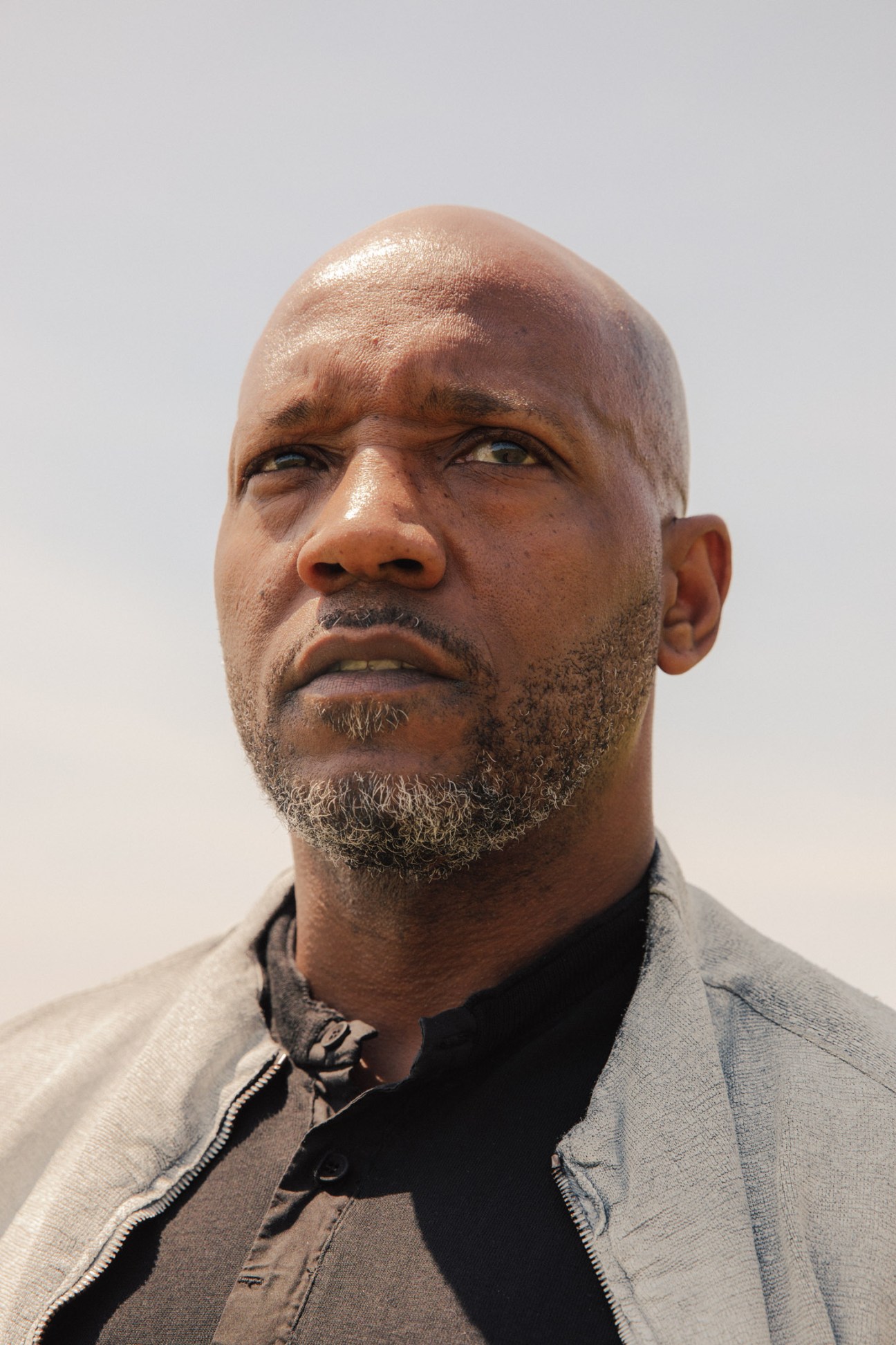 Portrait of Antoine Harris, an African-American developer in Tulsa, wearing a grey jacket.