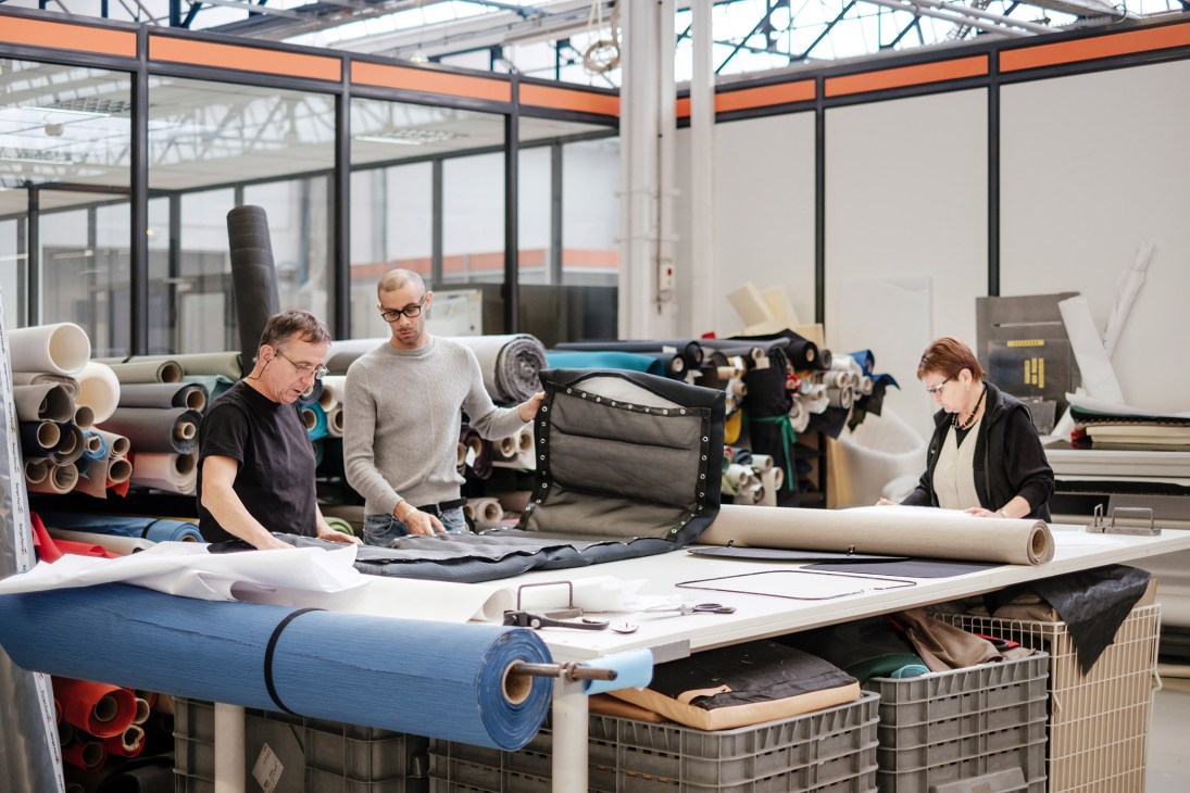 Workers design and develop outdoor furniture materials and frames in Lafuma Mobilier's research and development facility.