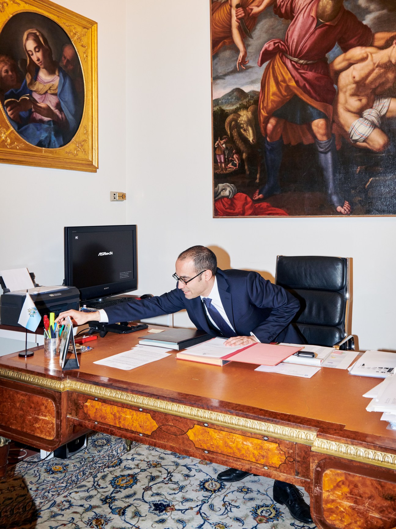 Nicola Renzi, San Marino's secretary of state for foreign affairs, works at his desk in Palazzo Begni.