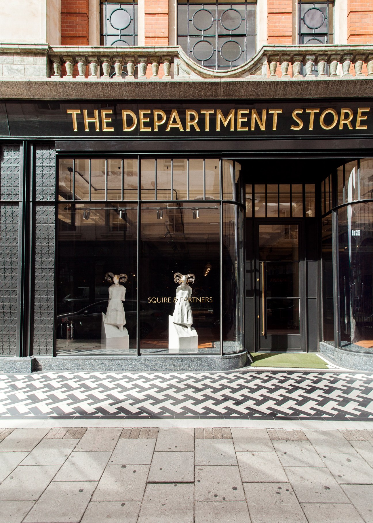 The Department Store storefront in Brixton with gold lettering, large windows displaying architectural models, and decorative tile details.