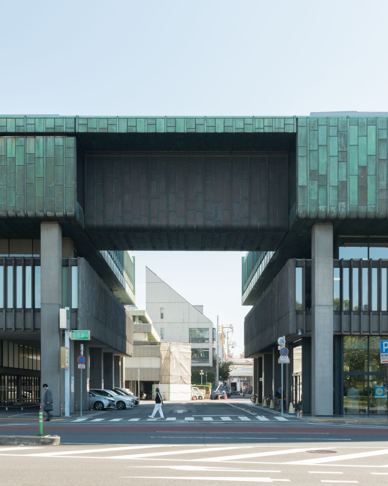 114 Bank's modernist facade featuring oxidised copper plates and concrete brutalist architecture in Takamatsu.