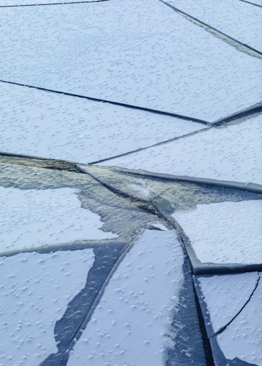 Close-up of ice channels cut by the icebreaker Kontio, showing refrozen sections amid broken ice floes.