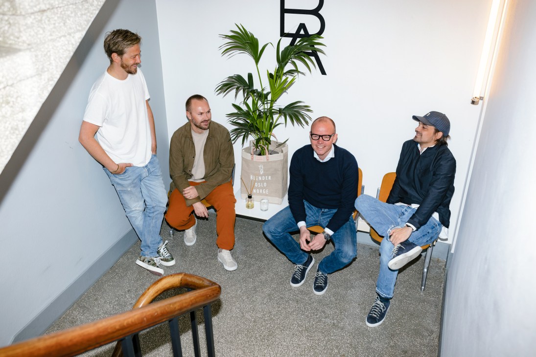 Five men gather in a white interior space at the Blender Agency in Oslo.