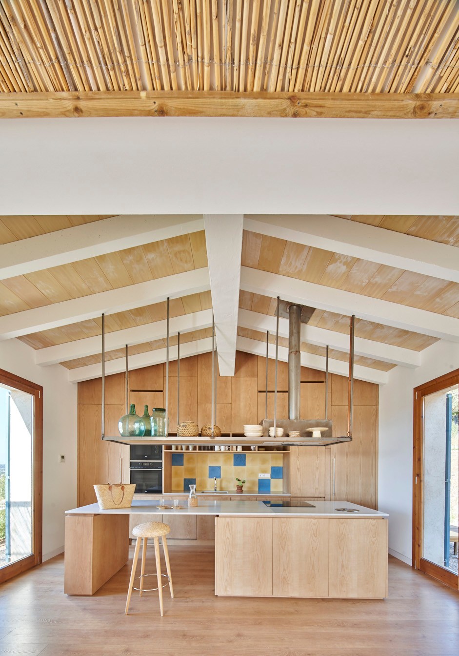 Kitchen with concrete roof supports usually used in agricultural buildings