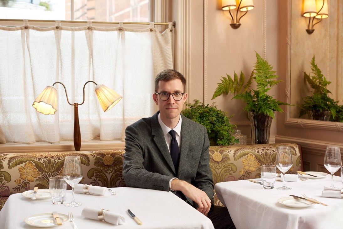 Connor Sheehan, general manager of Kettner's Townhouse, seated in the dining room.