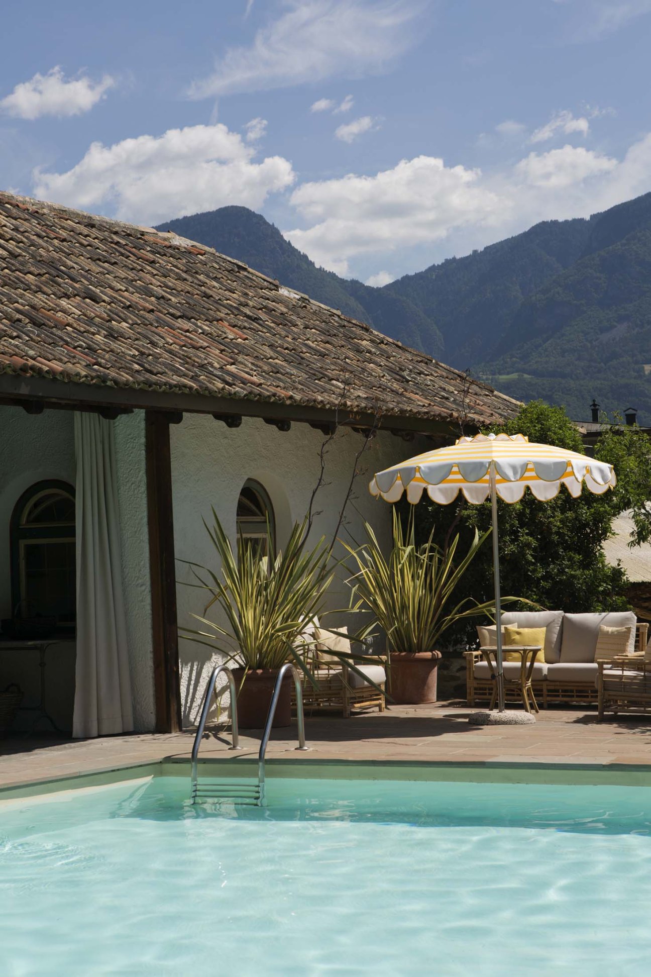 Pool area at Villa Arnica on a sunny day