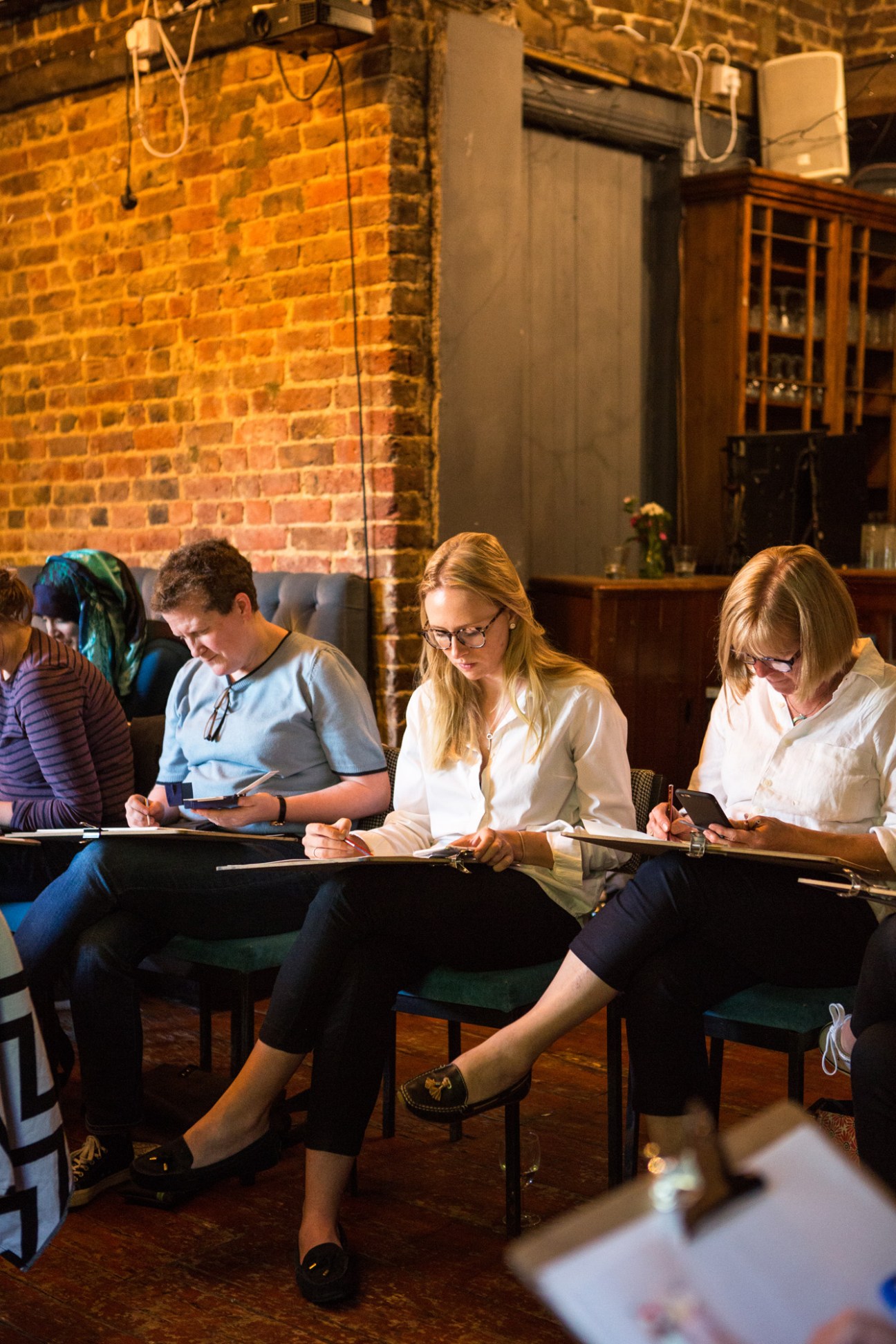 Student deep in concentration while sketching at life drawing class
