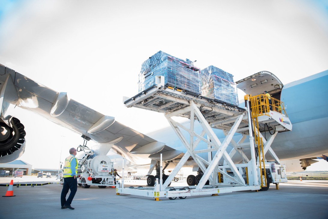 Cargo being loaded onto a Cathay Pacific freight plane at Wellcamp Airport via lifting platform.