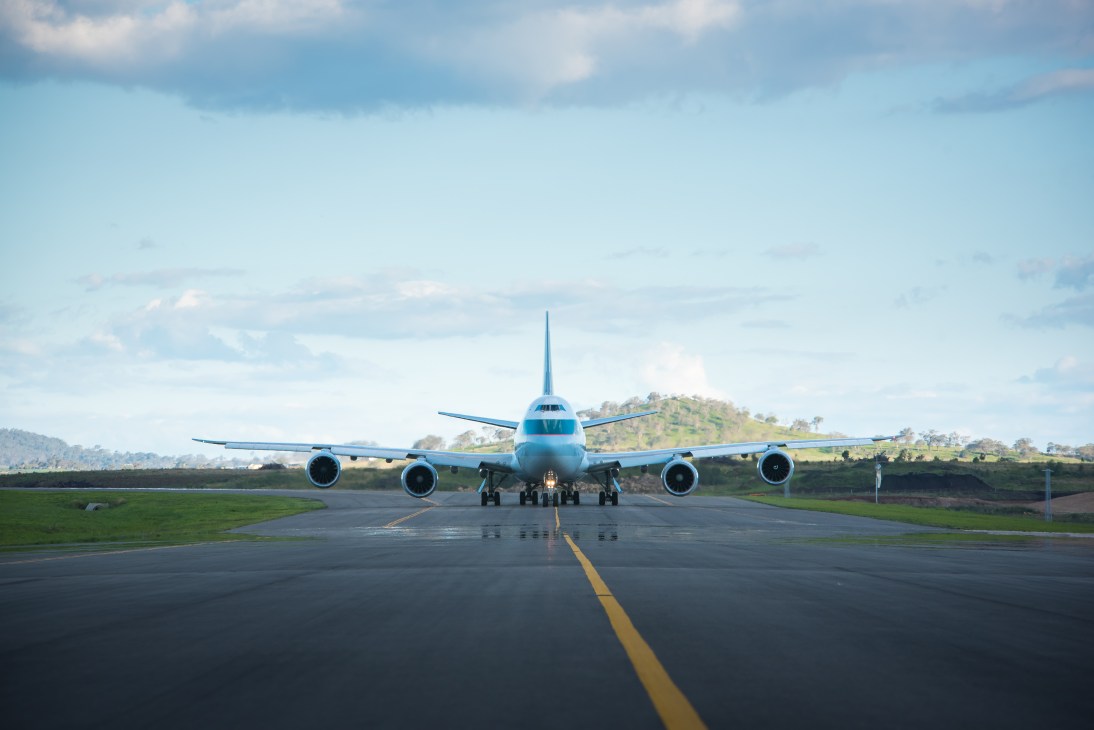 A blue and white freight aircraft on the runway at Brisbane West Wellcamp Airport