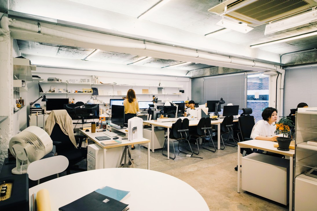 Z-Lab's open office workspace with multiple employees at desks and computers.